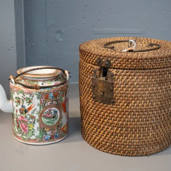Chinese porcelain teapot with wire and woven cane handles, in an insulated fine cane carry basket w/ metal handles -