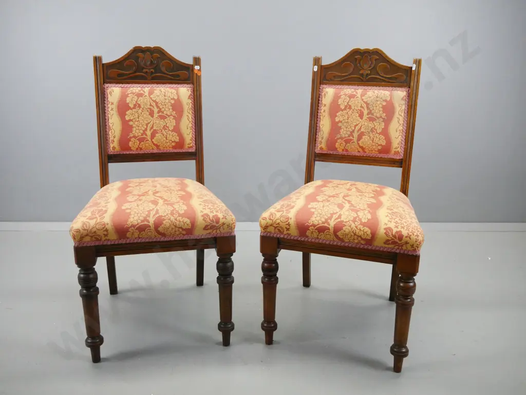 pair of walnut art nouveau style side chairs with shaped, carved crested backs, turned front legs, seat and back covered Image 1++