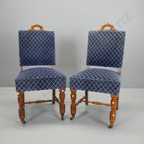 pair of walnut side chairs with foliate carved pierced cutout at top, turned front legs & stretcher base, brass crowns,