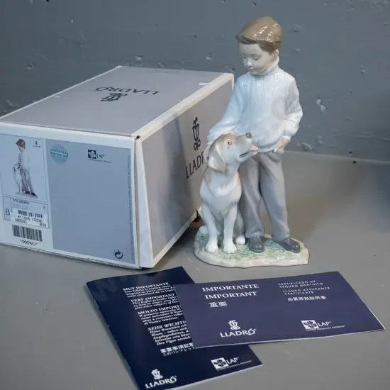 Lladro figurine with original box - boy with dog H-255 W-120