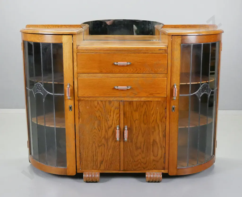 art deco oak double ended display case with small mirrored back, 2 drawers, quarter round ends with curved leadlight Image 1++
