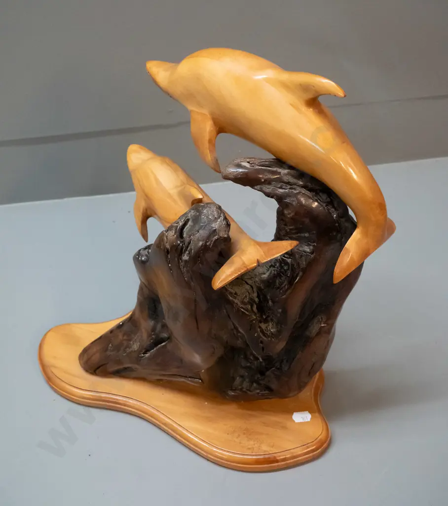 carved rimu figure of two leaping dolphins on piece of driftwood, label on base for Karaka Wood Gallery, Picton H-370 Image 1++