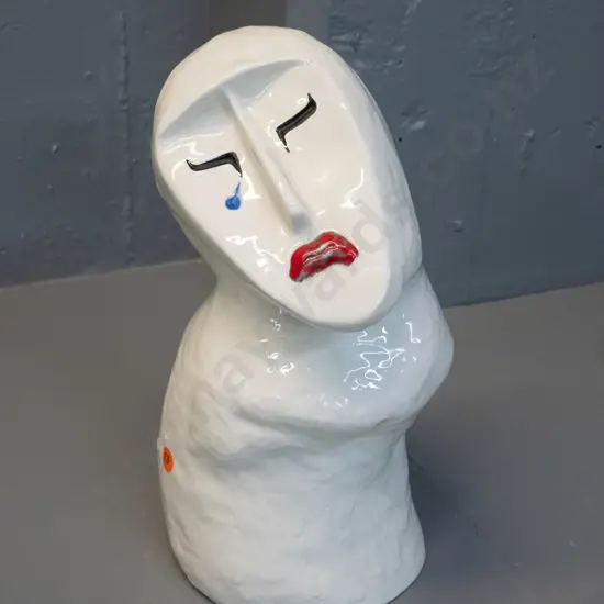 white ceramic figure with upturned sad face - impressed (Japanese?) maker's mark H-320