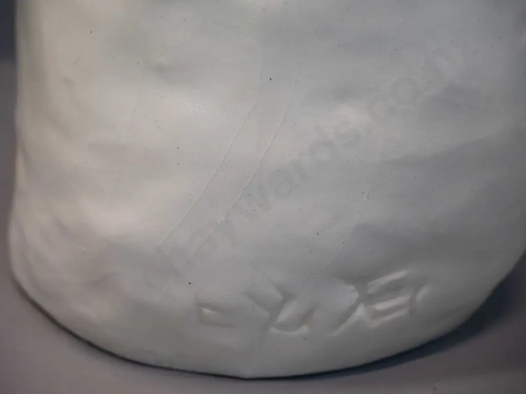 white ceramic figure with upturned sad face - impressed (Japanese?) maker's mark H-320 - some glaze crazing Image 1++