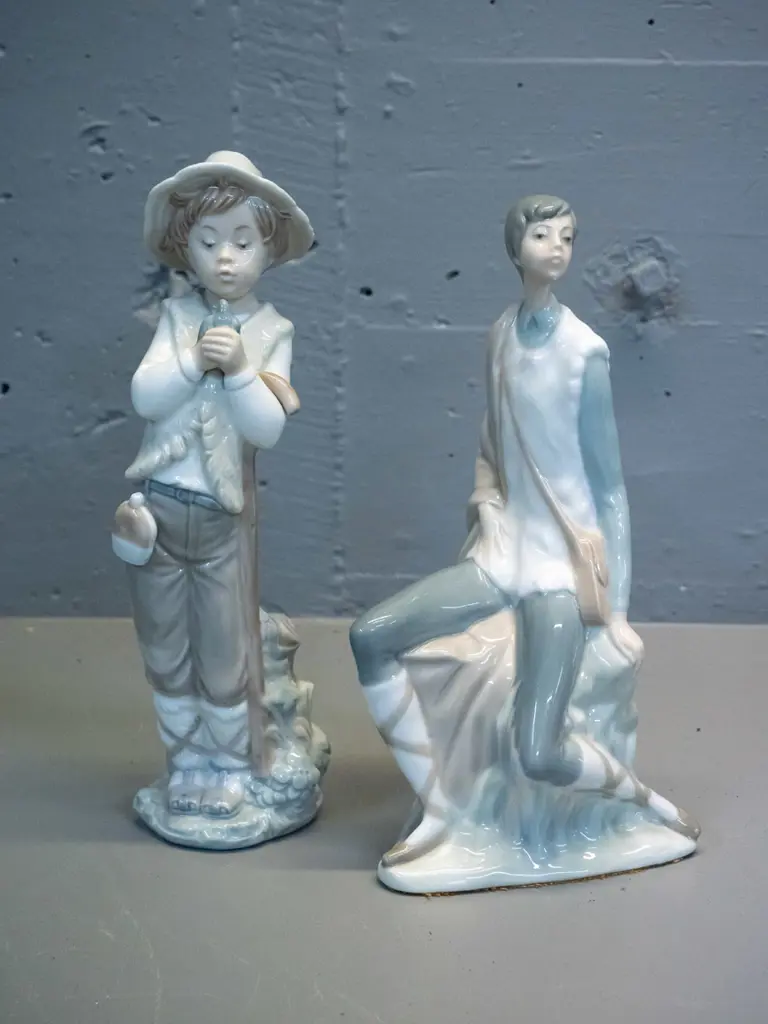 2 Nao figurines - boy with bird H-260 and one other Image 1++