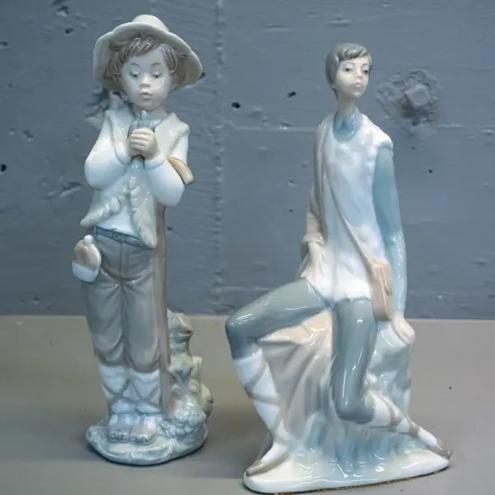 2 Nao figurines - boy with bird H-260 and one other