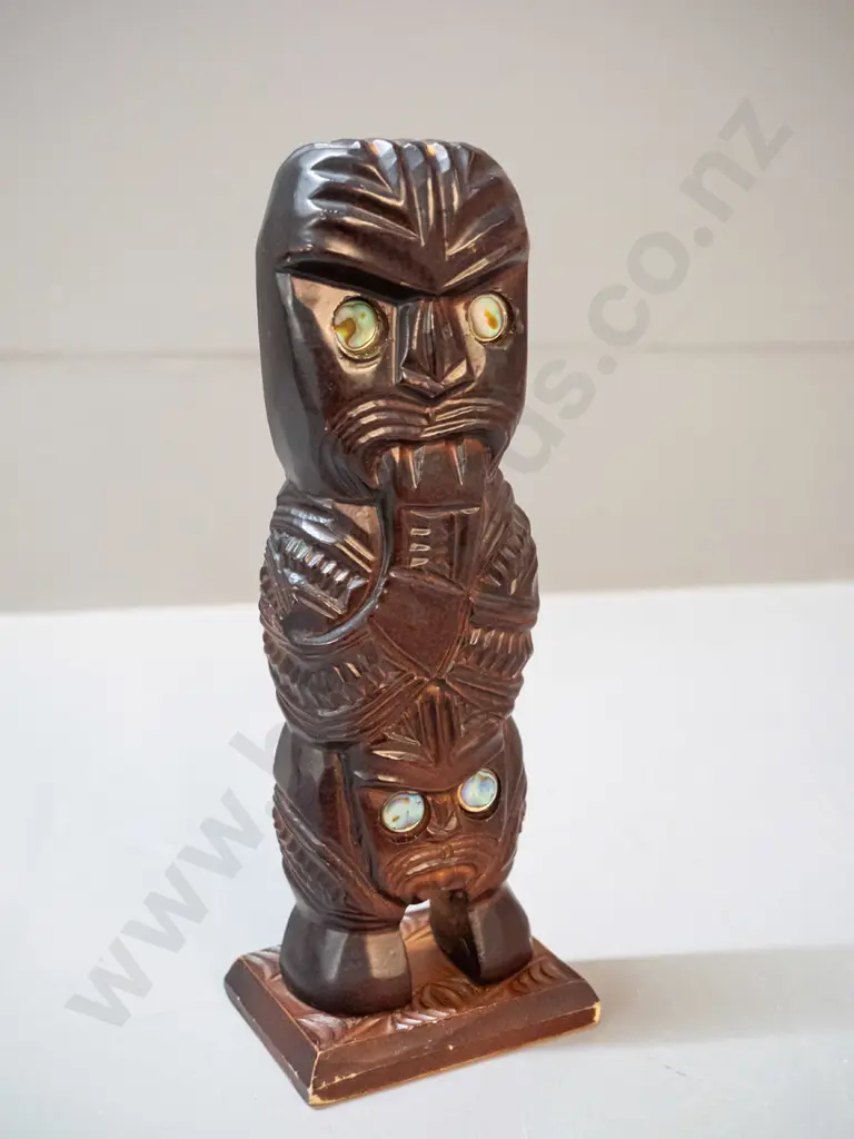 3 small souvenir items - carved timber tiki figure with paua insets, a cast brass shoe-horn and a plain timber mere with Image 1++