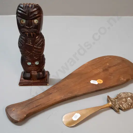 3 small souvenir items - carved timber tiki figure with paua insets, a cast brass shoe-horn and a plain timber mere with
