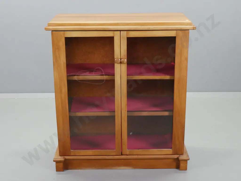 vintage rimu and beech 2-door display case with 2 adjustable shelves, timber knobs, on plinth base. Some staining to top Image 1++