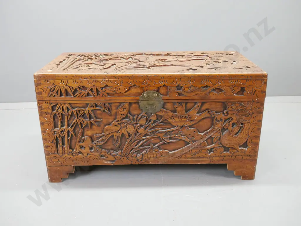 profusely carved camphorwood chest with heron and bamboo motifs, brass lock plate, damaged lock pieces inside Image 1++