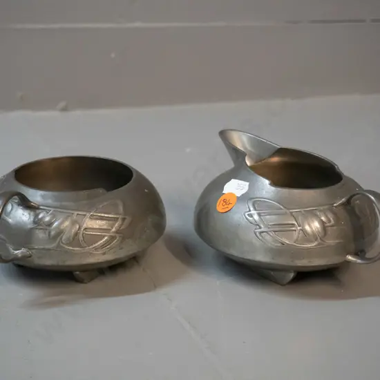 nouveau style English pewter milk jug and sugar bowl with pomegranate motifs, some surface scratches - jug H70 W145