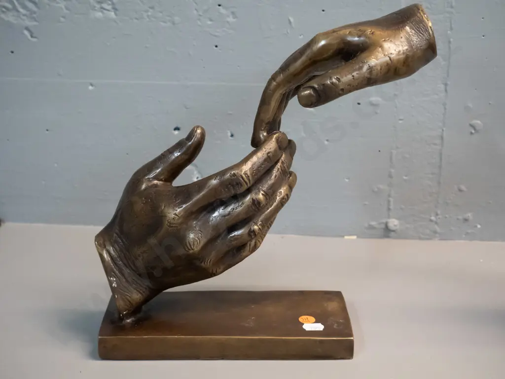brass or brass finish composite figure of two joined hands on rectangular base H-265 W-280 D-90 Image 1++
