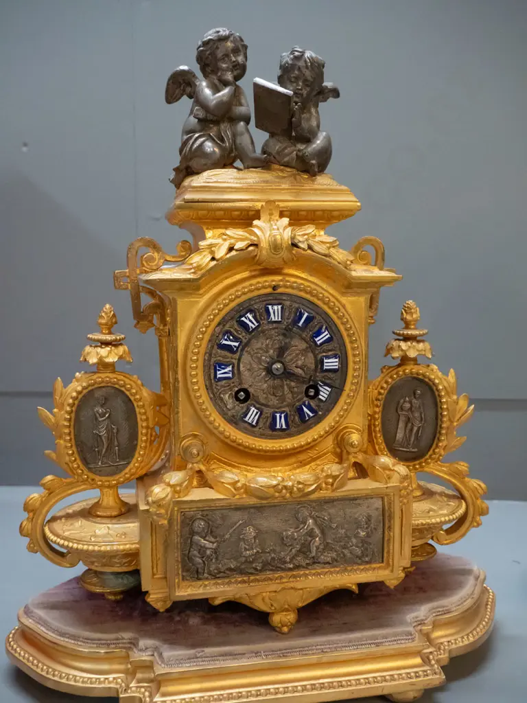 vintage ornate figural cast metal French mantel clock on timber with base glass dome, case stamped "PH Mourey" Image 1++