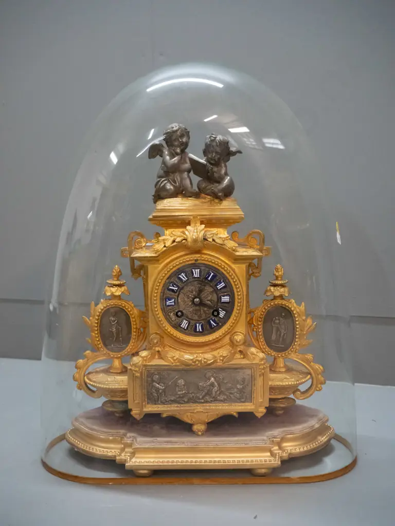 vintage ornate figural cast metal French mantel clock on timber with base glass dome, case stamped "PH Mourey" Image 1++