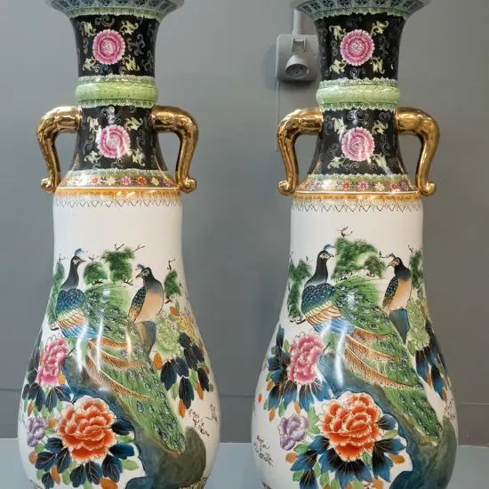 pair of very large pear shaped Chinese floor vases with gilt elephant head handles, raised peacock and flower motifs &