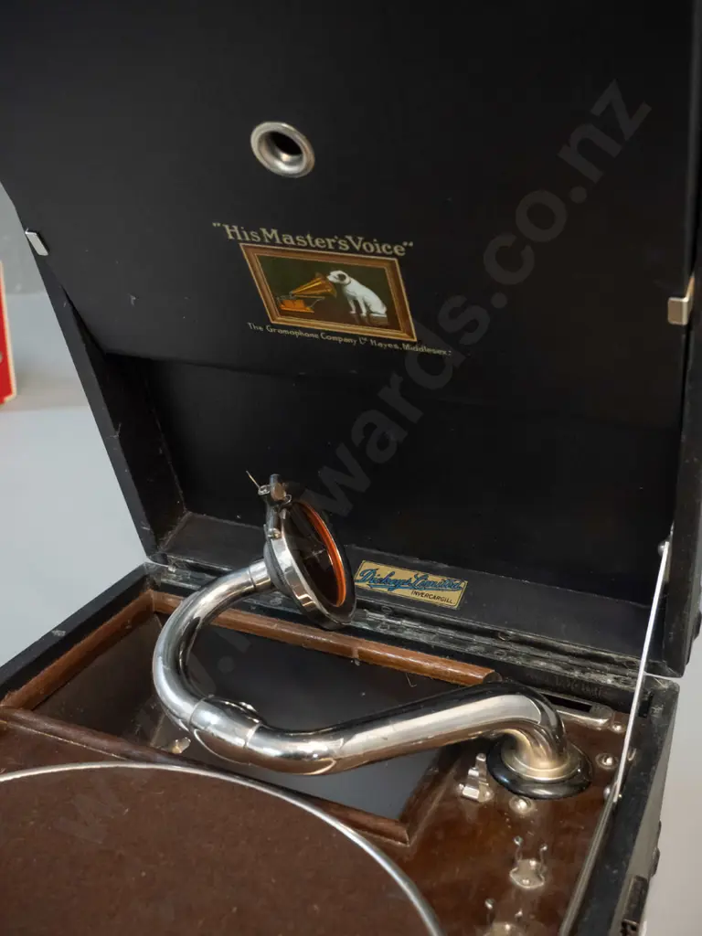 vintage portable wind-up gramophone with His Master's Voice and Dickey's Invercargill decals, with instruction booklet - Image 1++