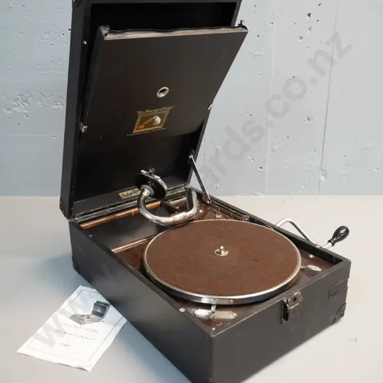 vintage portable wind-up gramophone with His Master's Voice and Dickey's Invercargill decals, with instruction booklet -
