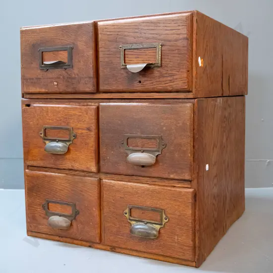 2 vintage oak library drawer cabinets with brass label handles, one 2-drawer and one 4-drawer, some chips and