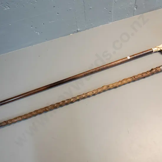 2 walking sticks - one with bone handle & sterling silver band, held on with tape L900 and one with faux bone composite