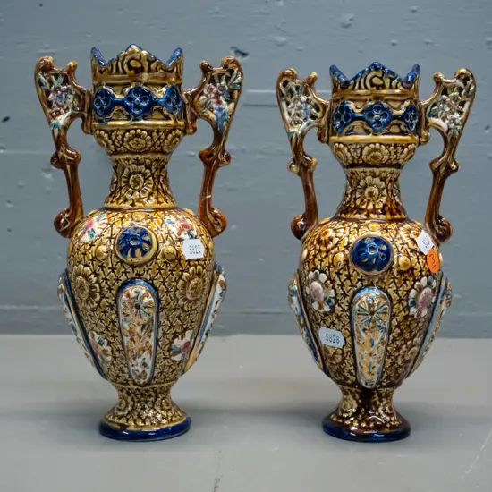 2 deep relief & sgraffito double handled urn vases in majolica colours, marked Alhambrian - one has obvious repair to