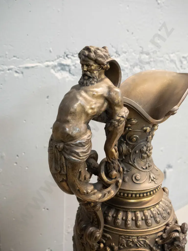 heavy cast metal urn with classical figural motifs, ram's heads, male figural handle, timber base H-610 D-220 at base Image 1++