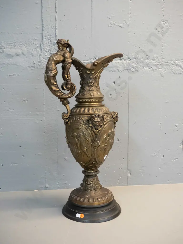 heavy cast metal urn with classical figural motifs, ram's heads, male figural handle, timber base H-610 D-220 at base Image 1++