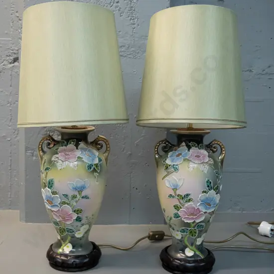 pair of table lamps - porcelain with raised floral decoration, on wooden bases H-600 including shades