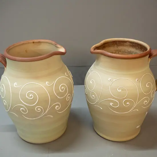 2 very large Denby jugs with white raised scroll decoration H-320 W-300 at handle - one has some staining inside rim,