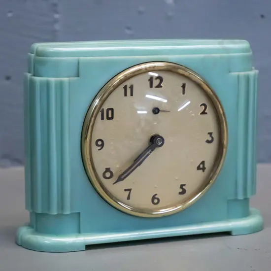 deco French 'Jaz' brand alarm clock in marbled green bakelite case, wind up mechanism is going. Brass bezel has some age