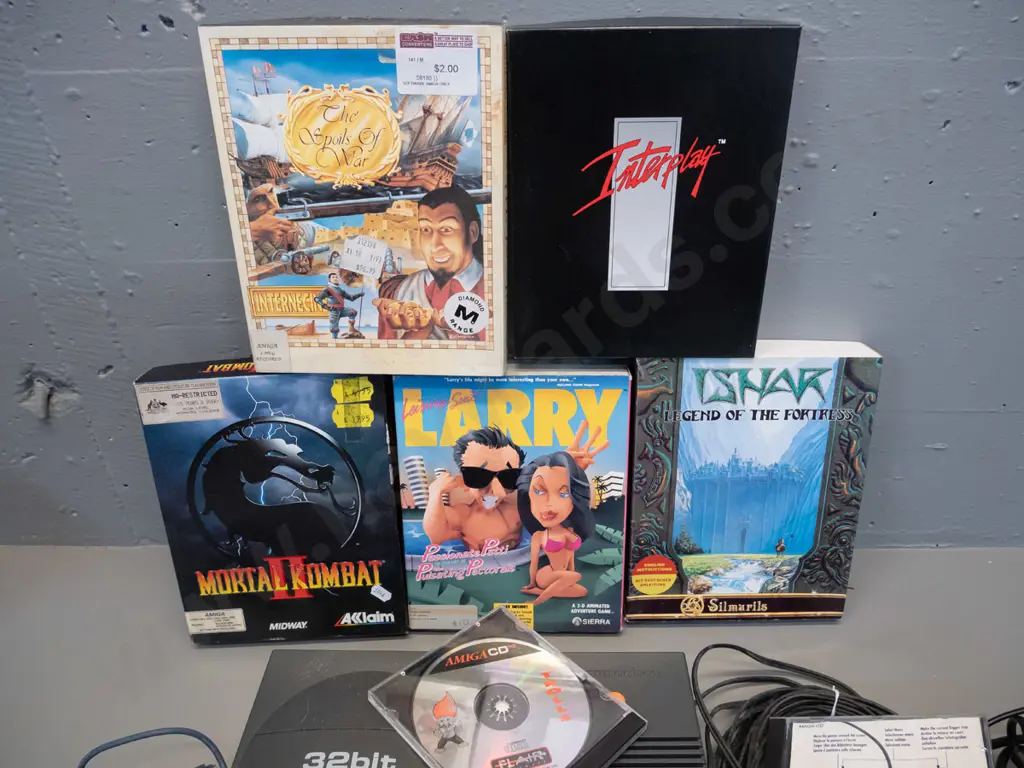 early 90s Commodore Amiga CD32 games console with power supply, 2 controllers, cables, and 5 boxed games - untested Image 1++