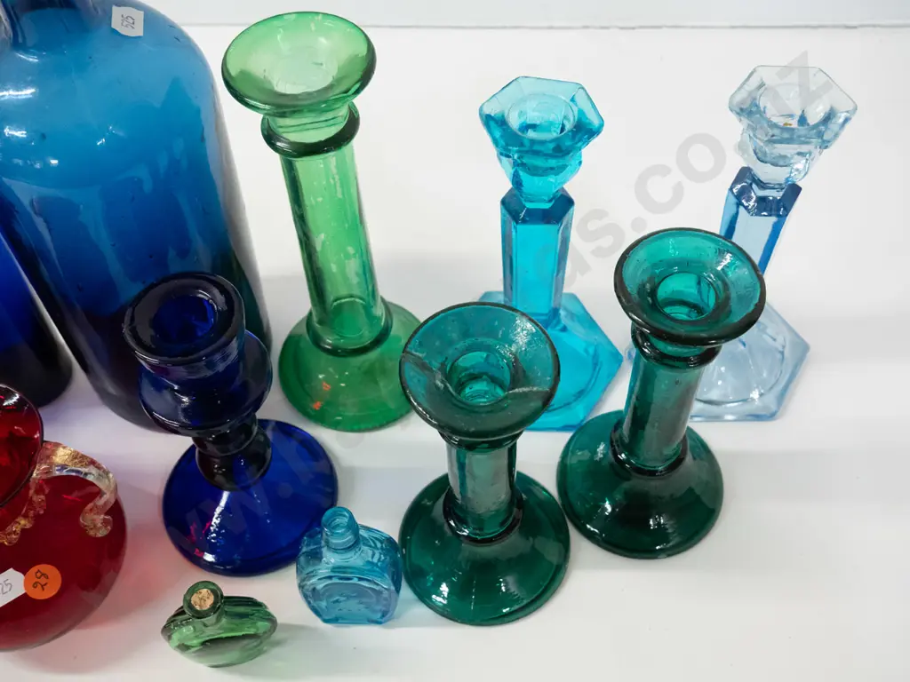 assorted coloured glass items - moulded candlesticks, cobalt blue bottles, ruby jug, etc - one candlestick has been Image 1++