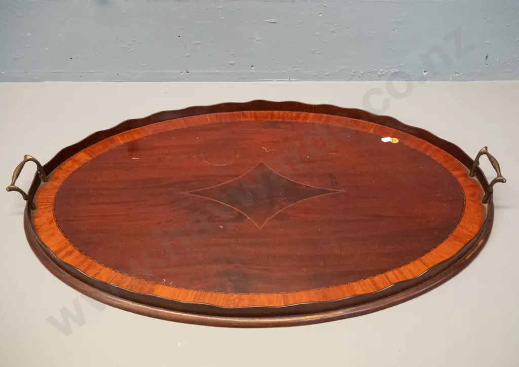 large oval timber tray with scalloped timber gallery, brass handles, inlaid stringing decoration - some marks to polish Image 1++