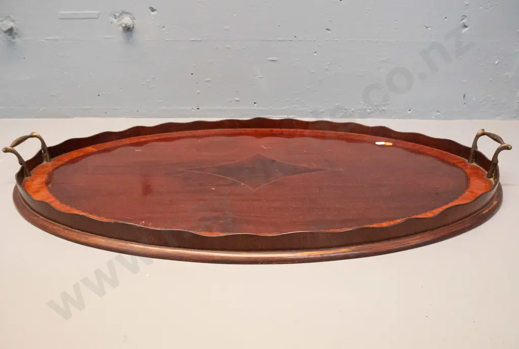 large oval timber tray with scalloped timber gallery, brass handles, inlaid stringing decoration - some marks to polish Image 1++