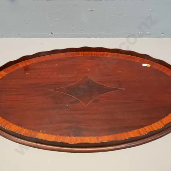 large oval timber tray with scalloped timber gallery, brass handles, inlaid stringing decoration - some marks to polish