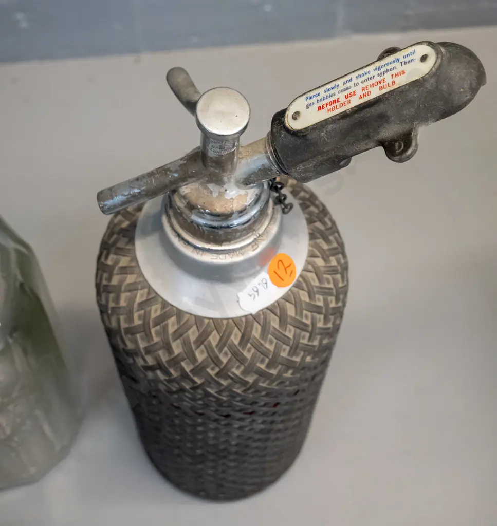 2 vintage soda syphons - one with Lane's Dunedin Oamaru mark to bottle and chrome top, other with wire mesh - some Image 1++