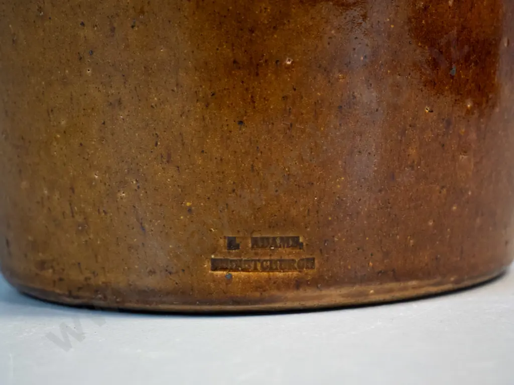 brown glazed large pouring crock / jug - marked Luke Adams Christchurch - crack near spout, chip to rim H-270 W-200 Image 1++