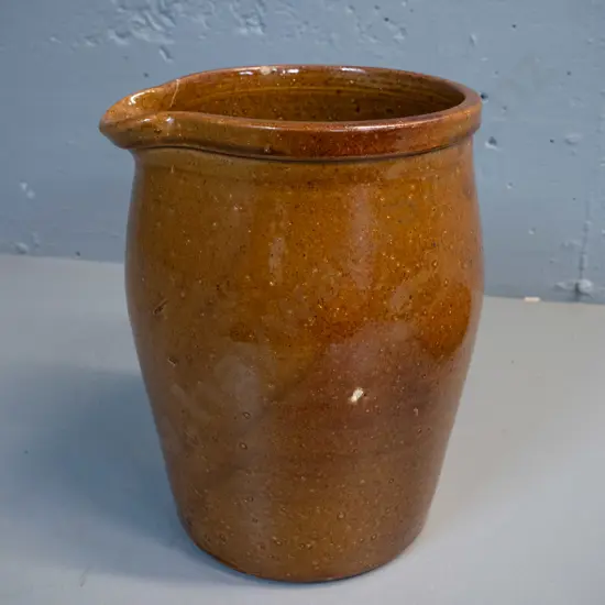 brown glazed large pouring crock / jug - marked Luke Adams Christchurch - crack near spout, chip to rim H-270 W-200