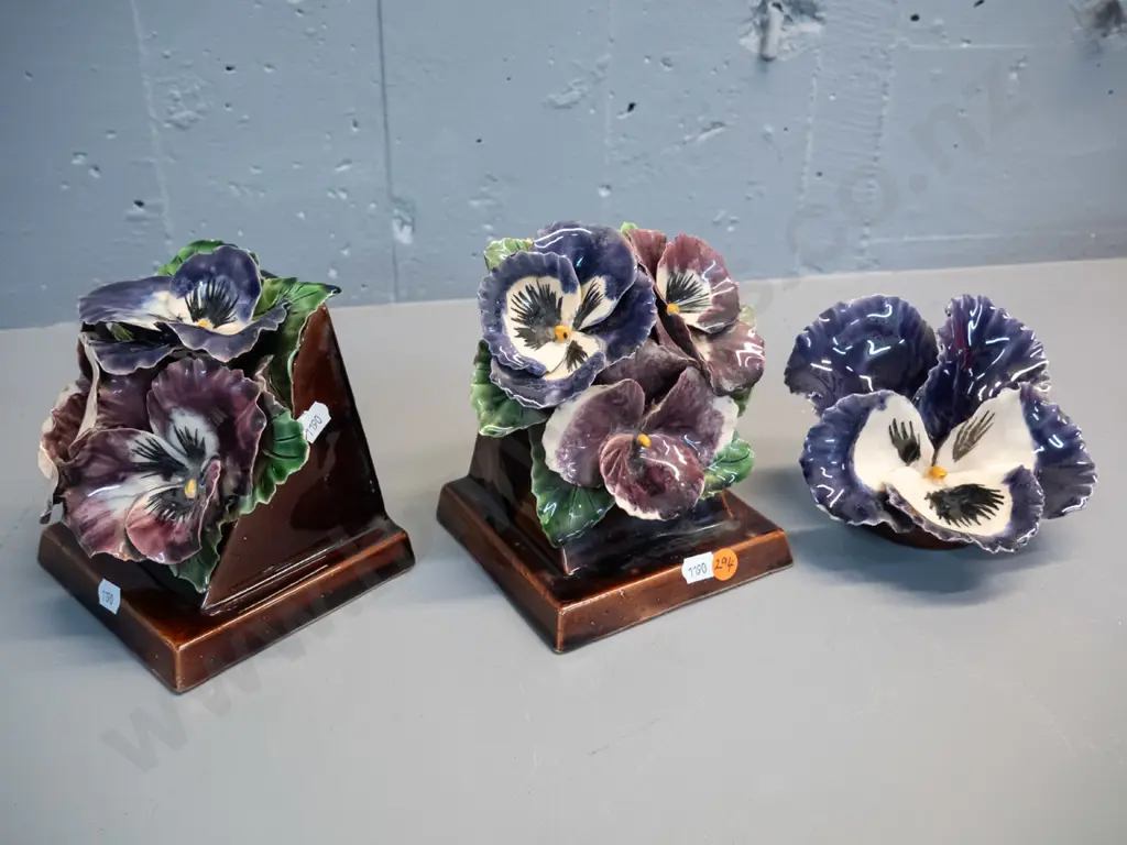 3 hand potted applied pansy motif pottery items - pair of book-ends H-150 W-120 and matching wall hanging. A few chips Image 1++