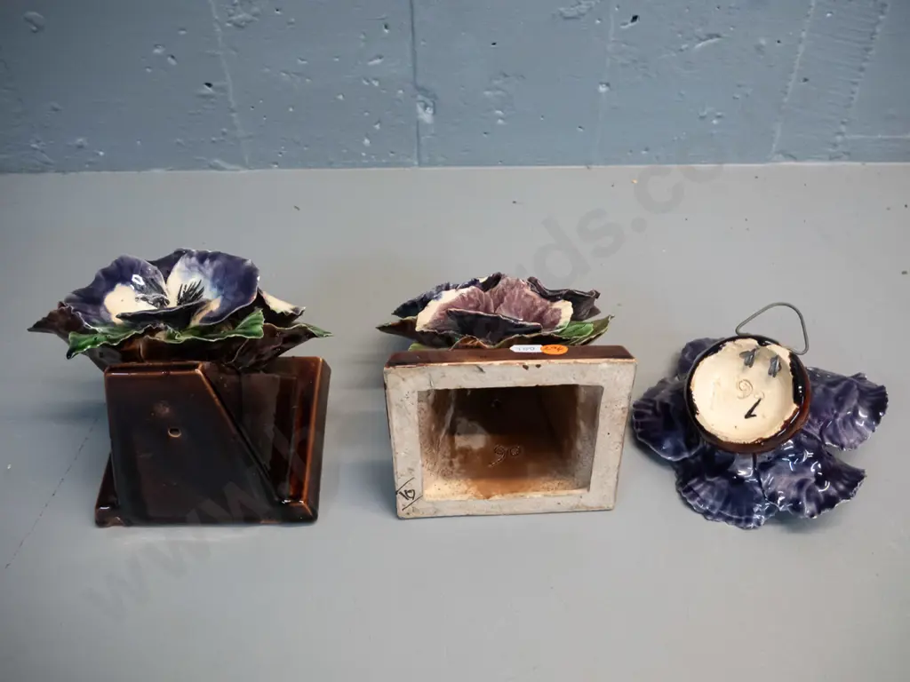 3 hand potted applied pansy motif pottery items - pair of book-ends H-150 W-120 and matching wall hanging. A few chips Image 1++