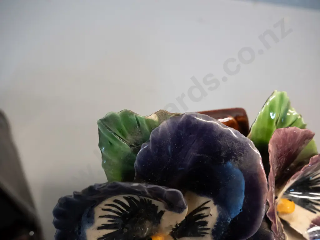 3 hand potted applied pansy motif pottery items - pair of book-ends H-150 W-120 and matching wall hanging. A few chips Image 1++