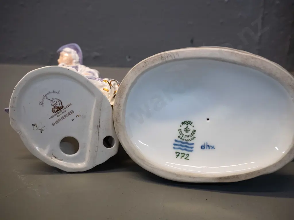 2 figurines - Wedgwood Shepherdess hand painted with a glaze fault to hand H185 and a Royal Copenhagen 772 boy with calf Image 1++