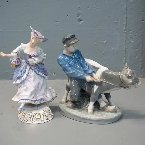 2 figurines - Wedgwood Shepherdess hand painted with a glaze fault to hand H185 and a Royal Copenhagen 772 boy with calf