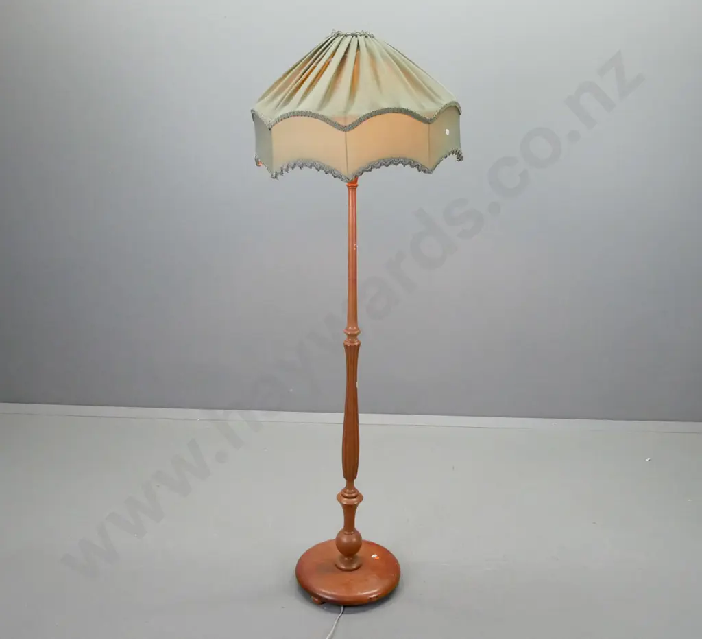 vintage mahogany standard lamp with fluted turned column, circular base 3 bun feet, shaped and pleated green fabric Image 1++