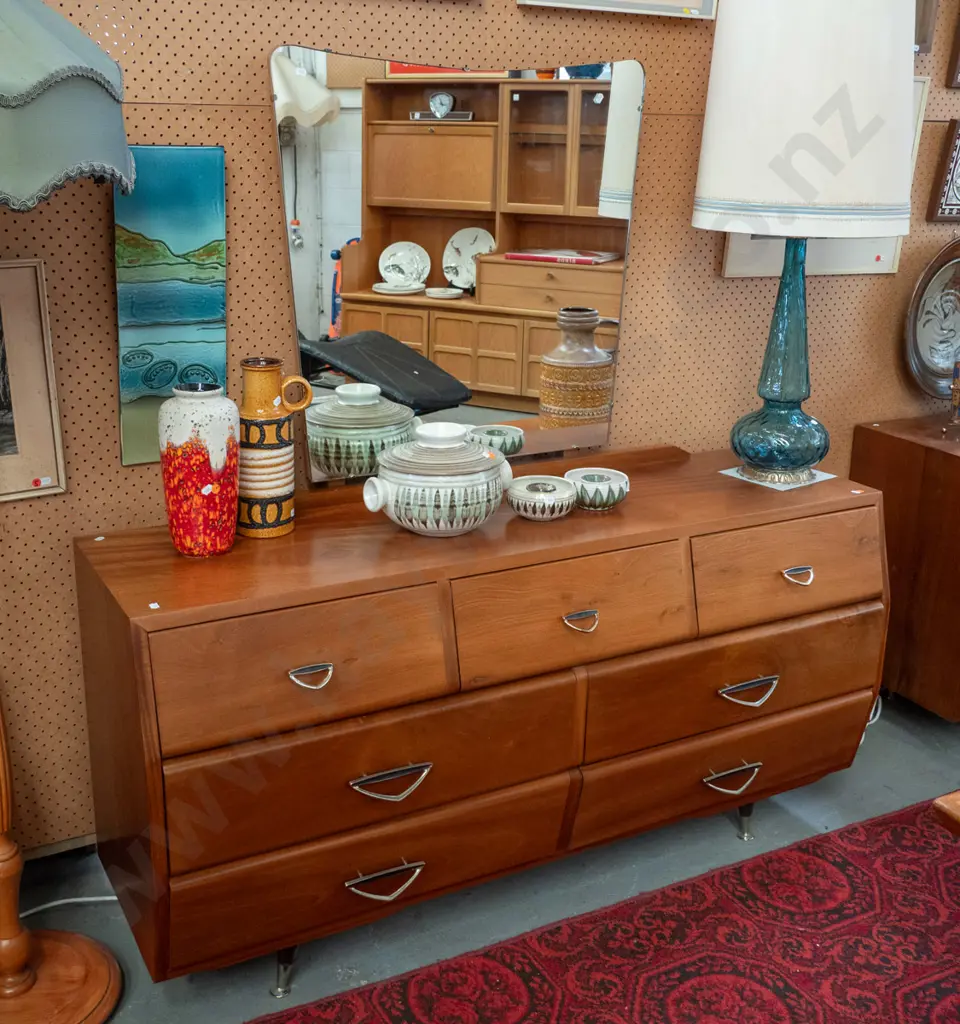 retro mahogany low 7-drawer dresser with shaped mirror, metal diamond shaped handles, round splayed feet, has Zealandia Image 1++