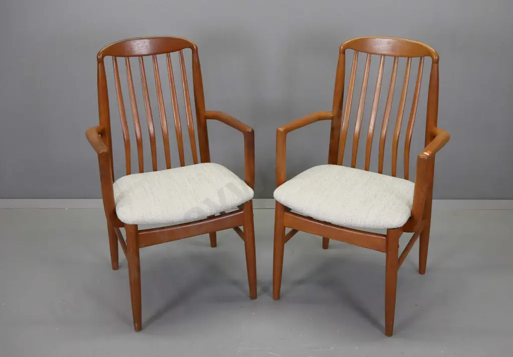 pair of mid-century teak rib-back armchairs with fabric upholstered seats, on round tapered legs - minor wear to arms Image 1++