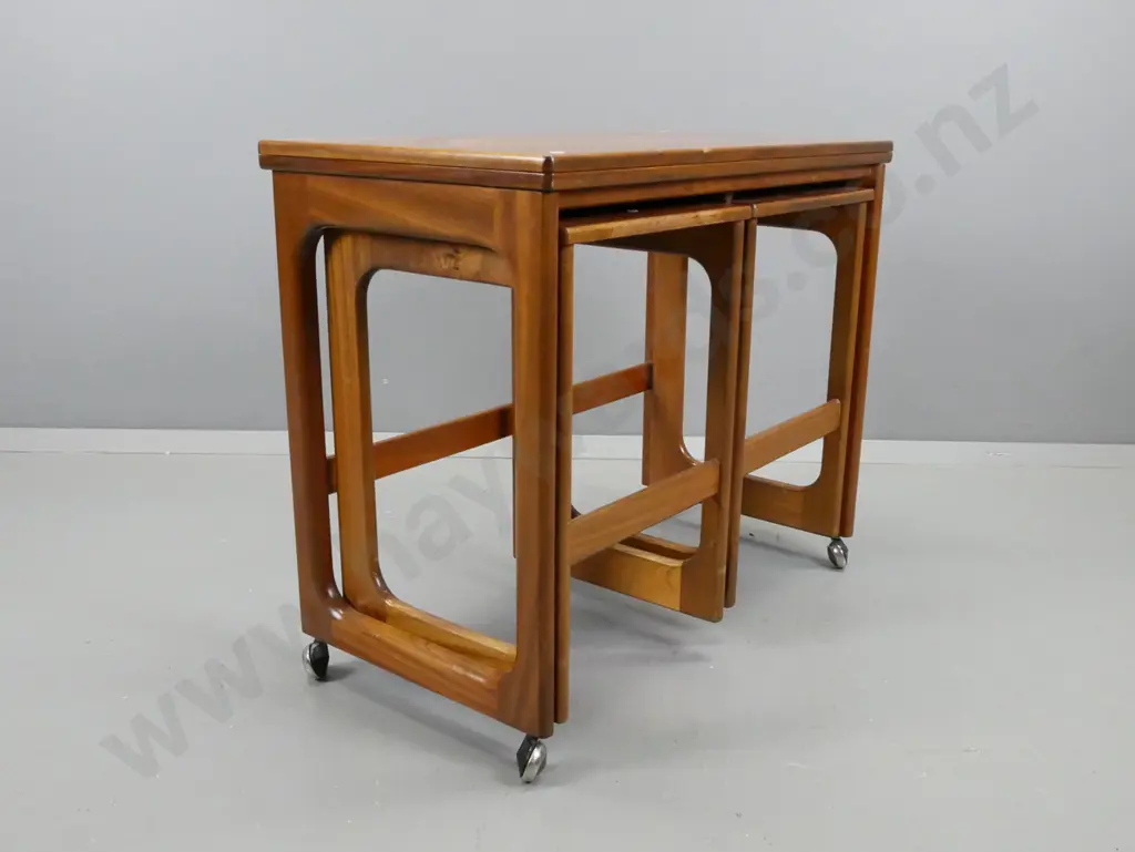 mid-century teak fold-over top tea / games table on casters, with 2 hanging slide out nesting side tables Image 1++