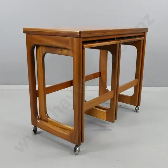 mid-century teak fold-over top tea / games table on casters, with 2 hanging slide out nesting side tables