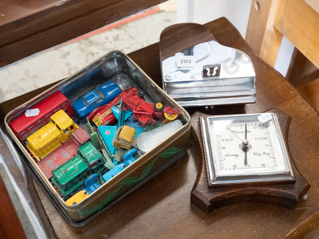 tin of model vehicles, barometer, and a metal piano themed trinket box Image 1++