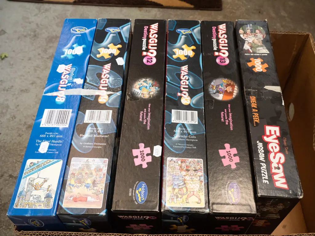 box of Wasgij puzzles Image 1++