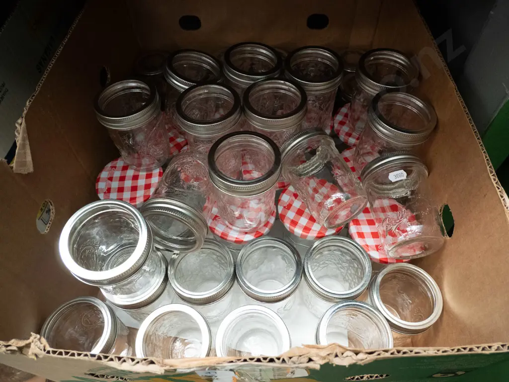 box of preserving jars, some with lids Image 1++